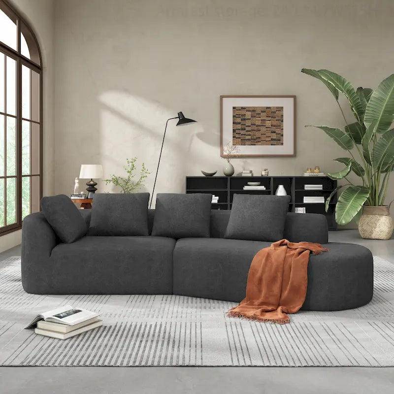 Canapé d'angle incurvé moderne avec revêtement de haute qualité et assise spacieuse