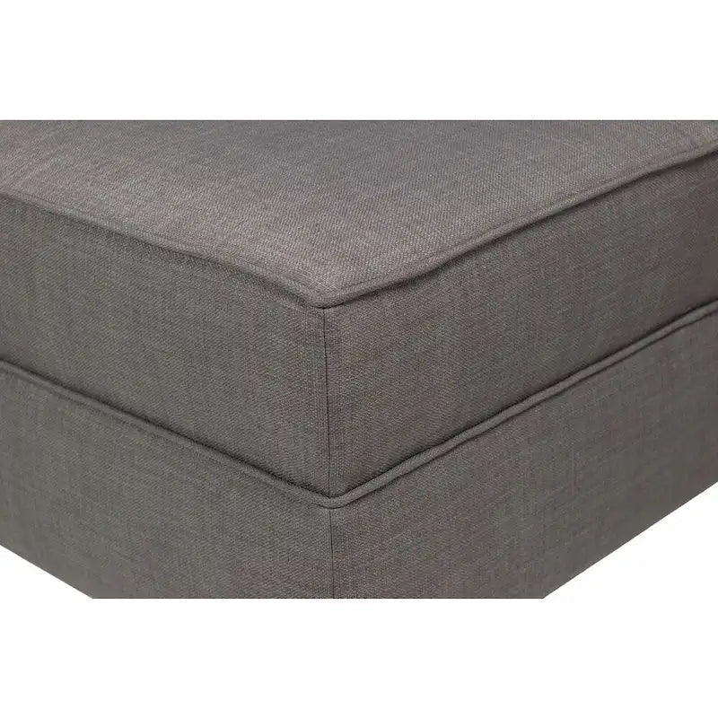 Grand pouf ottoman rembourré avec passepoil